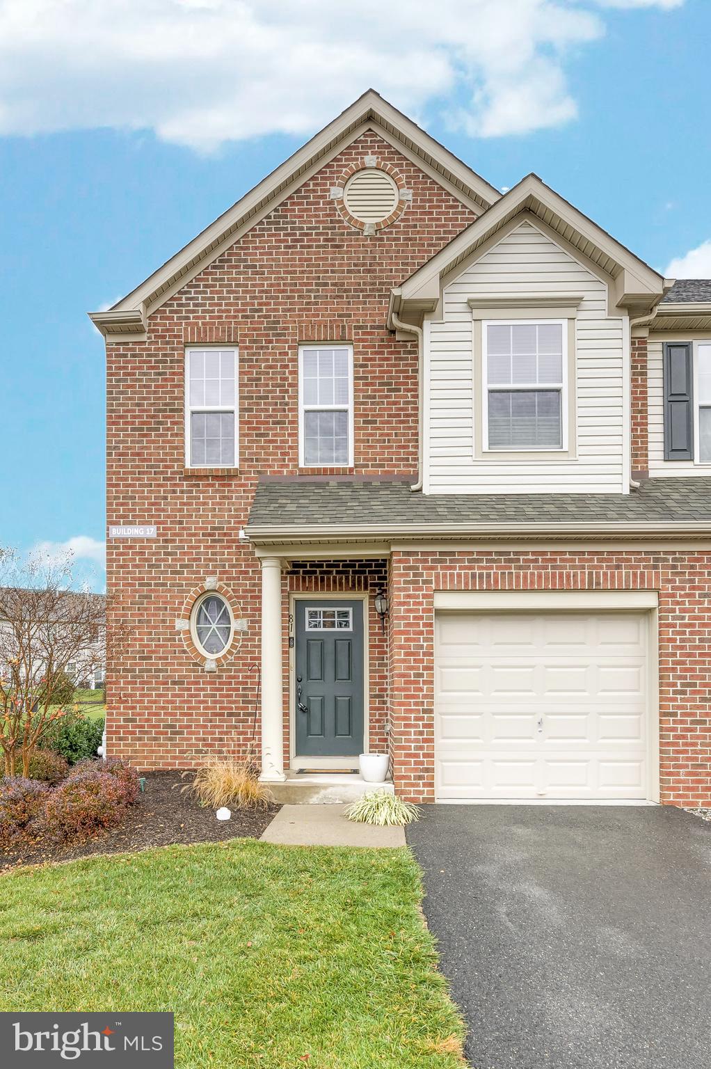 81 Sundance Drive Hamilton, NJ 08619 - Photo 2 of 44 a front view of a house with a yard and garage