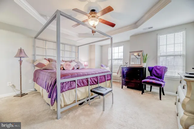 a bedroom with a bed and a book shelf