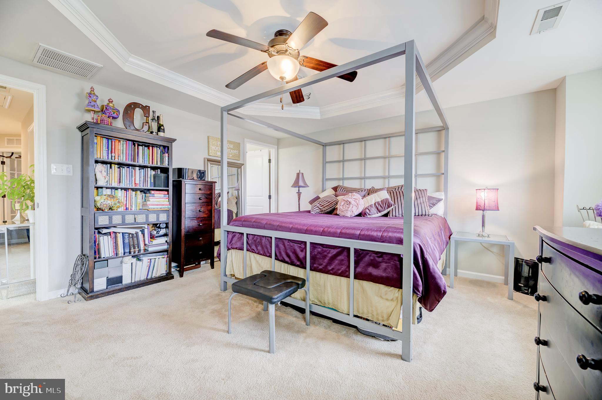 81 Sundance Drive Hamilton, NJ 08619 - Photo 24 of 44 a bedroom with a bed and a book shelf