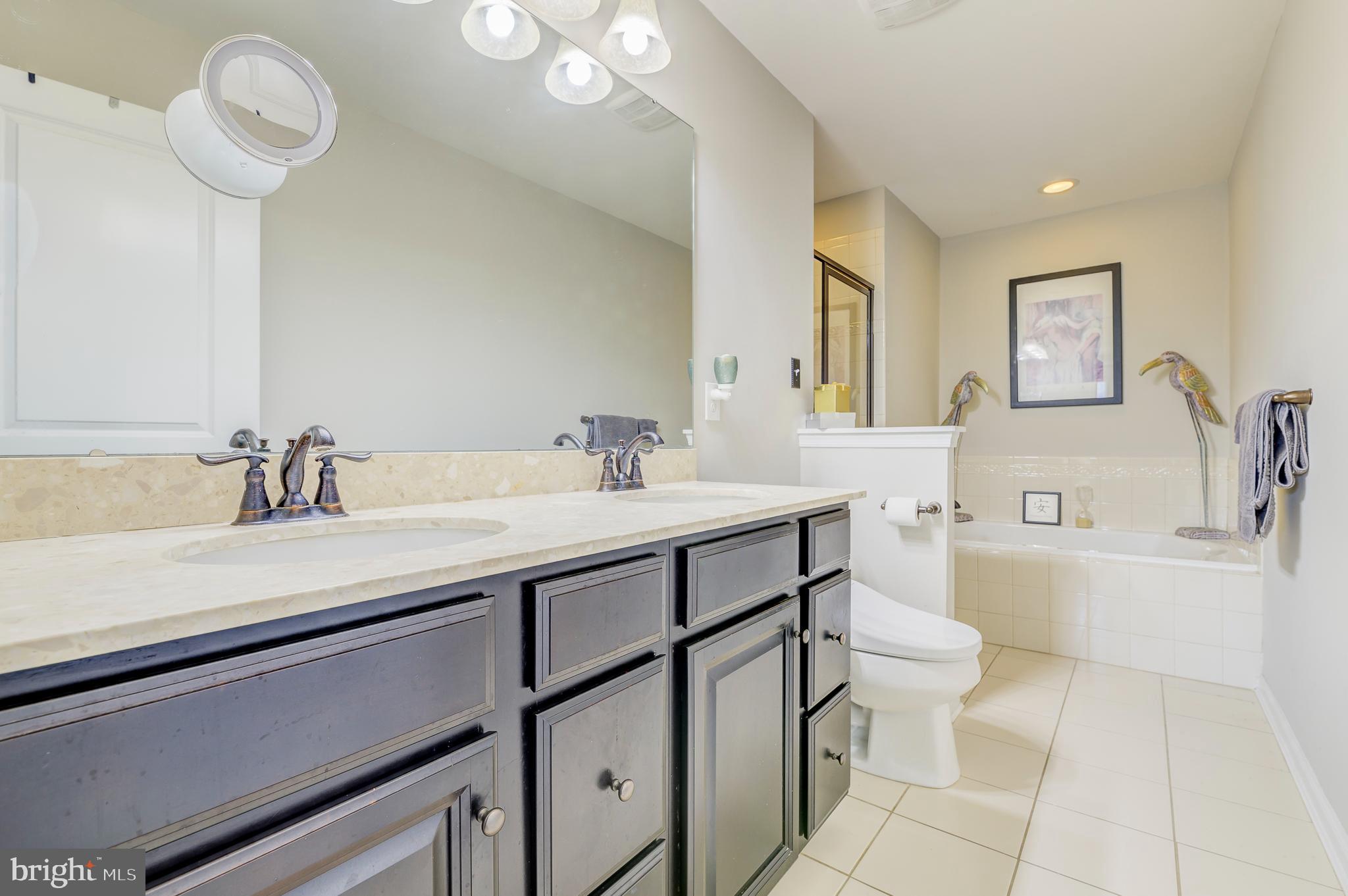 81 Sundance Drive Hamilton, NJ 08619 - Photo 25 of 44 a spacious bathroom with a sink double vanity and a mirror