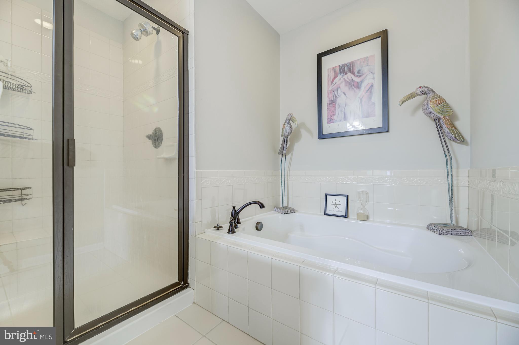 81 Sundance Drive Hamilton, NJ 08619 - Photo 26 of 44 a bathroom with a white tub and shower