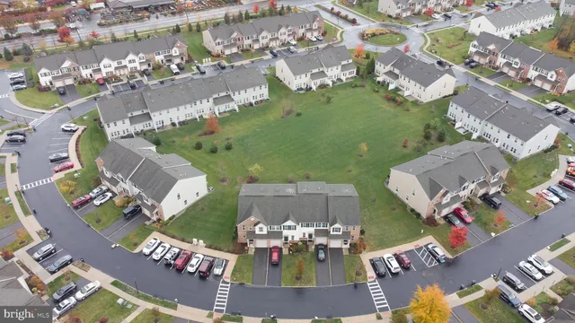 a aerial view of multiple houses with yard