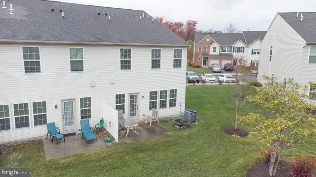 a view of an chairs and table in the balcony