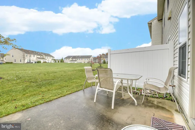a building outdoor space with patio furniture and a patio