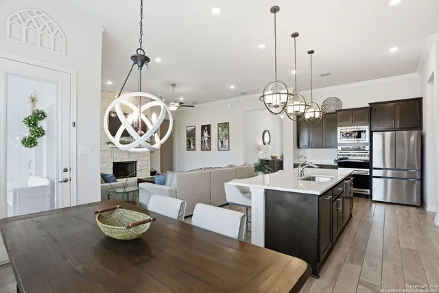 a kitchen with a table and chairs