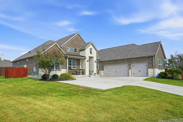 a front view of a house with garden and porch