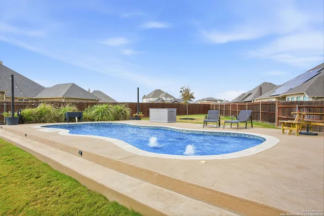 a view of a swimming pool with a terrace