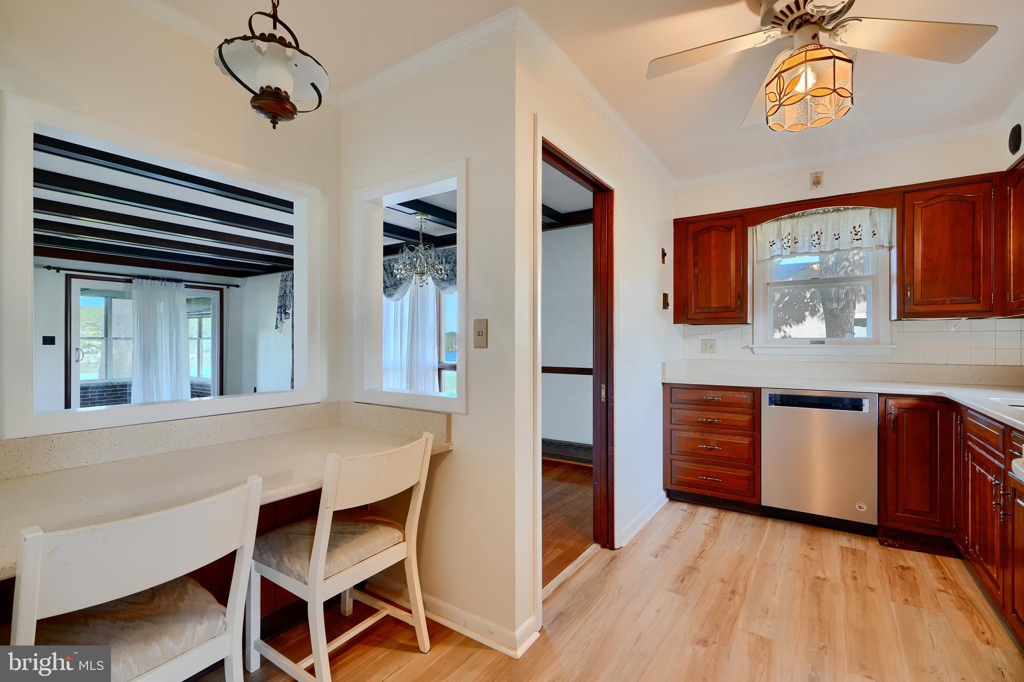 1924 Cedar Road Pasadena, MD 21122 - Photo 11 of 43 a kitchen with stainless steel appliances granite countertop a sink and cabinets