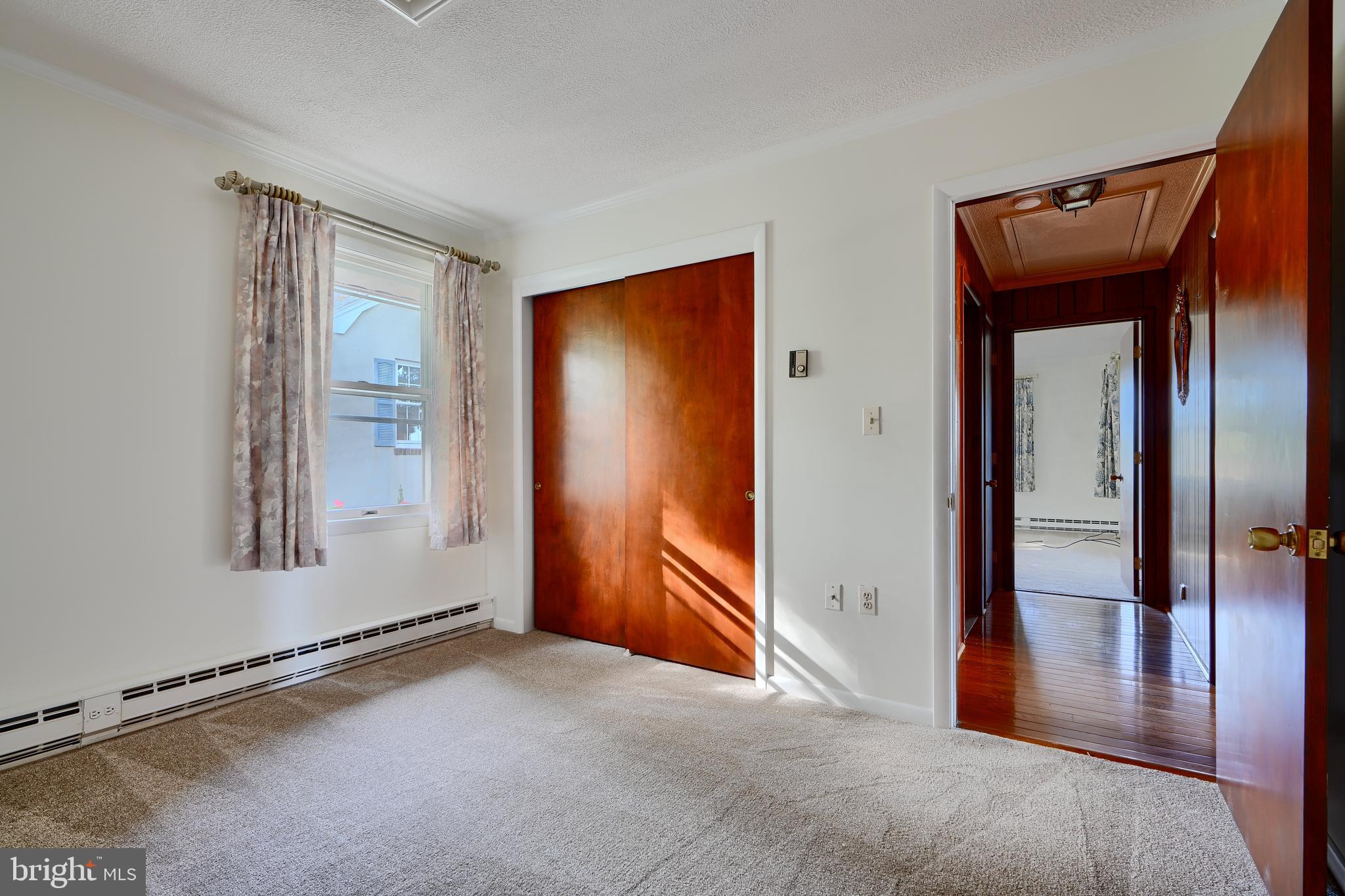 1924 Cedar Road Pasadena, MD 21122 - Photo 16 of 43 an empty room with windows and closet