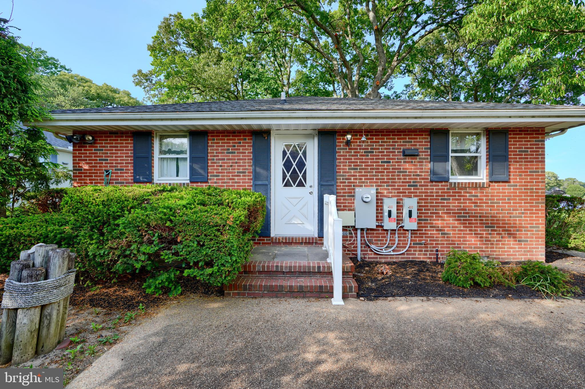 1924 Cedar Road Pasadena, MD 21122 - Photo 2 of 43 a front view of a house with garden