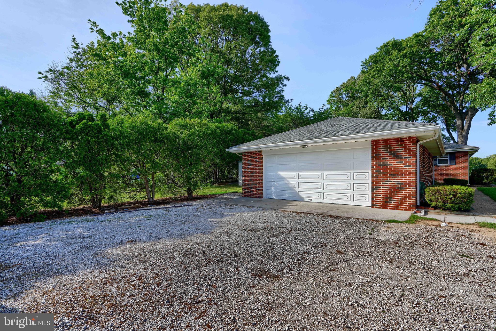1924 Cedar Road Pasadena, MD 21122 - Photo 3 of 43 a view of a house with a yard and garage