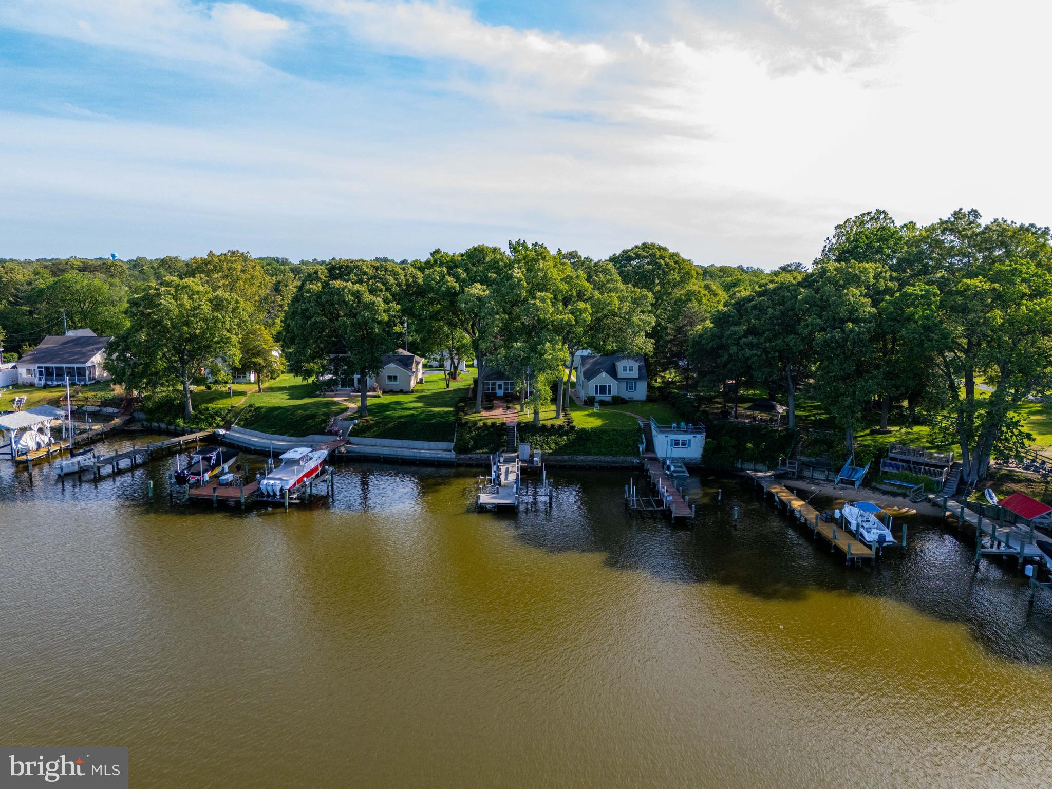1924 Cedar Road Pasadena, MD 21122 - Photo 40 of 43 a view of swimming pool with outdoor seating and lake
