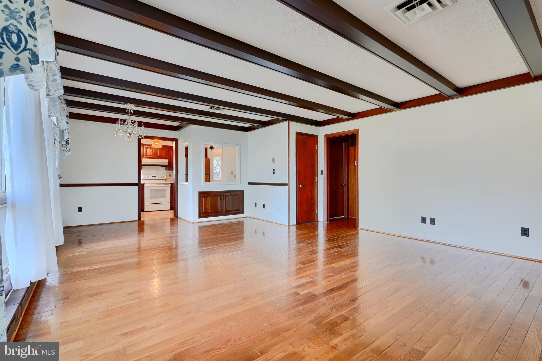 1924 Cedar Road Pasadena, MD 21122 - Photo 8 of 43 a view of empty room with wooden floor and cabinet