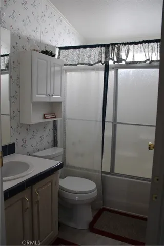 a bedroom with a bed and dresser