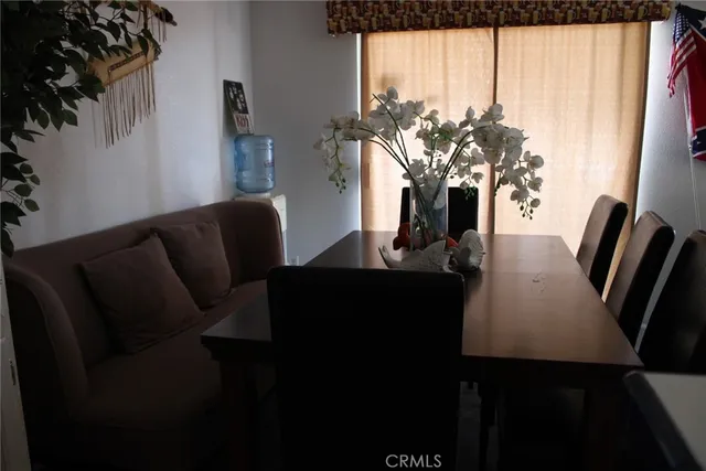 a living room with furniture window and wooden floor