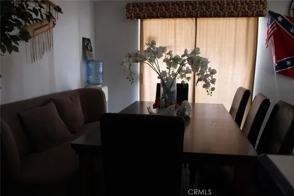 a front view of a house with seating space