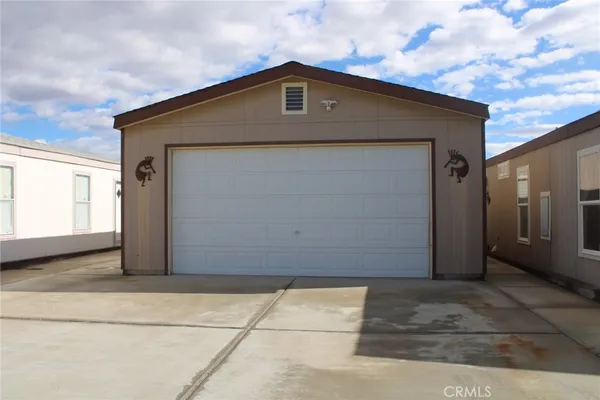 a kitchen with stainless steel appliances a sink and cabinets