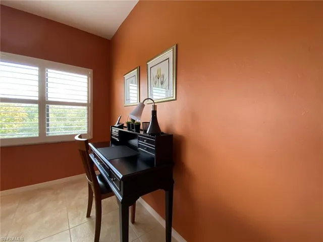 a room with a table and a window