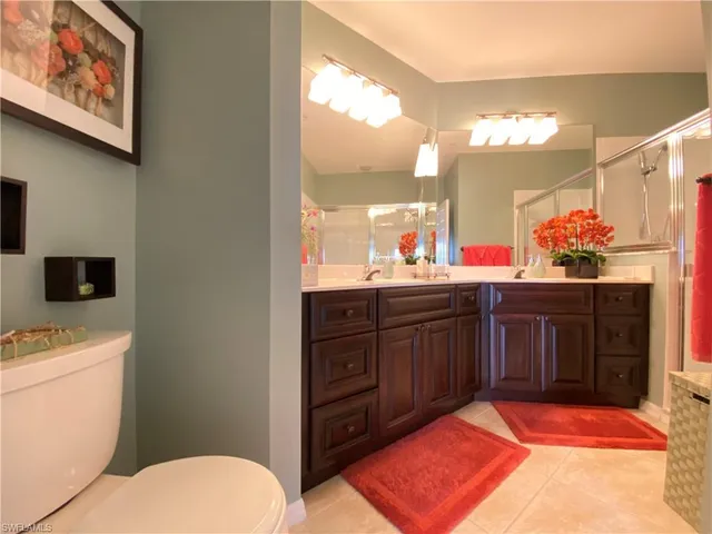 a bathroom with a sink vanity and a mirror