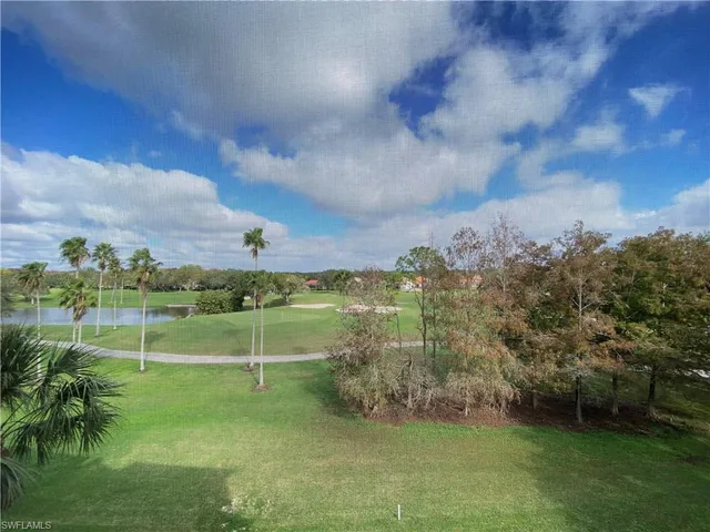 a view of a golf course with a lake