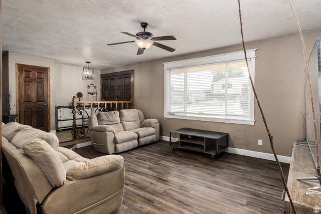 100 Third North Helper, UT 84526 - Photo 14 of 30 Living area featuring wood-finish flooring and neutral wall tones