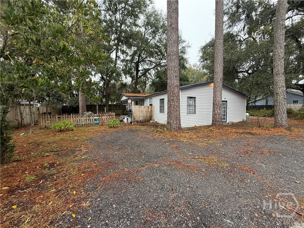 316 Edgewater Road Savannah, GA 31406 - Photo 3 of 13 Side view of house 316. Home sits in front section of lot closest to Edgewater Rd