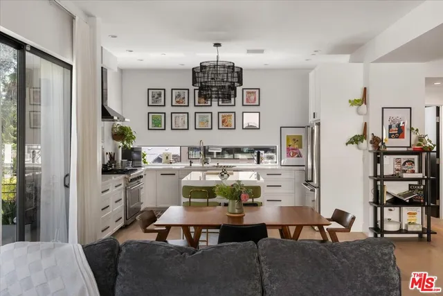 a living room with furniture a rug and white walls