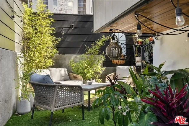 a view of a chairs and table in the patio