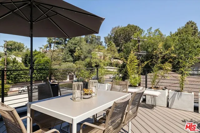 a patio with table and chairs