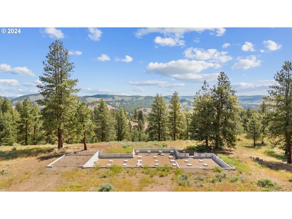 a view of a swimming pool with an outdoor space and seating area