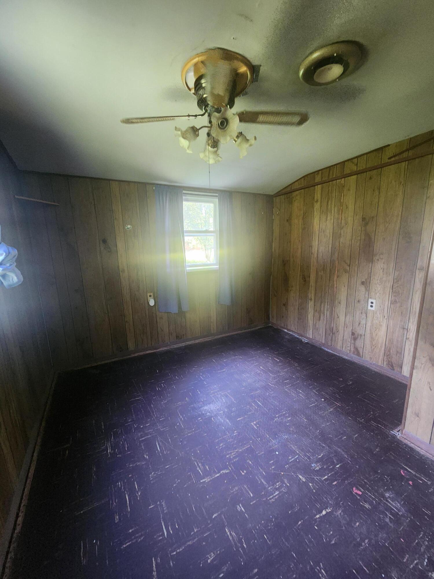 14205 Jay Street Dyer, IN 46311 - Photo 9 of 17 an empty room with a ceiling fan and window