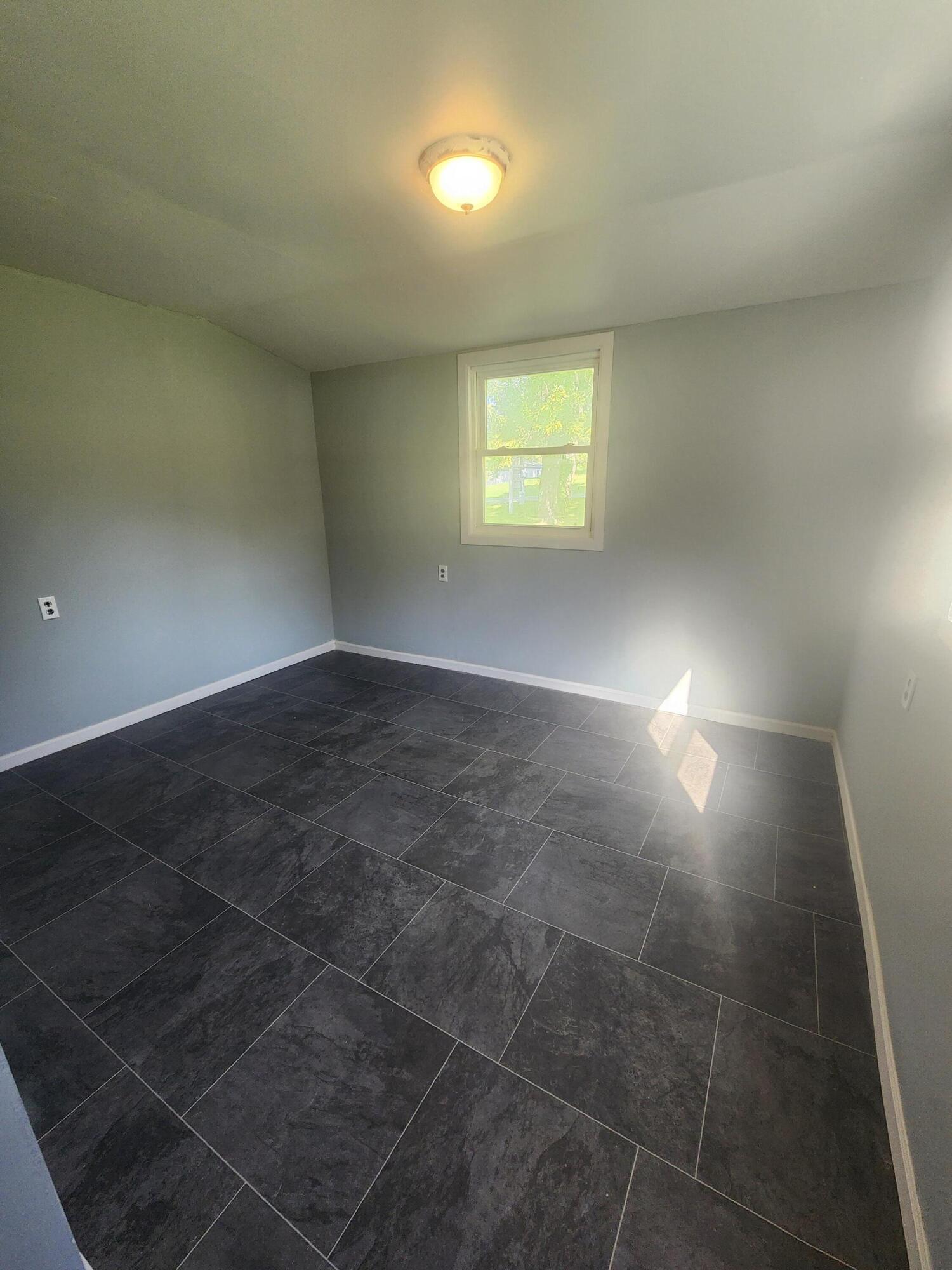 14205 Jay Street Dyer, IN 46311 - Photo 10 of 17 a view of an empty room and window