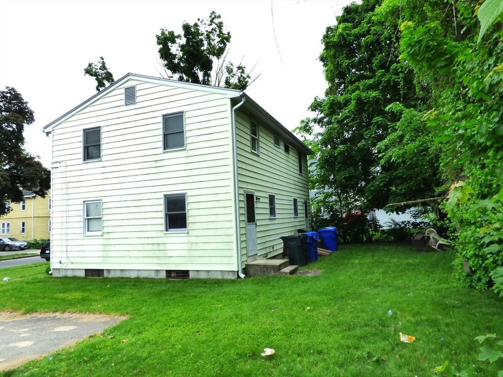 26-28 Daniel Street Springfield, MA 01151 - Photo 3 of 15 a view of a house with a backyard