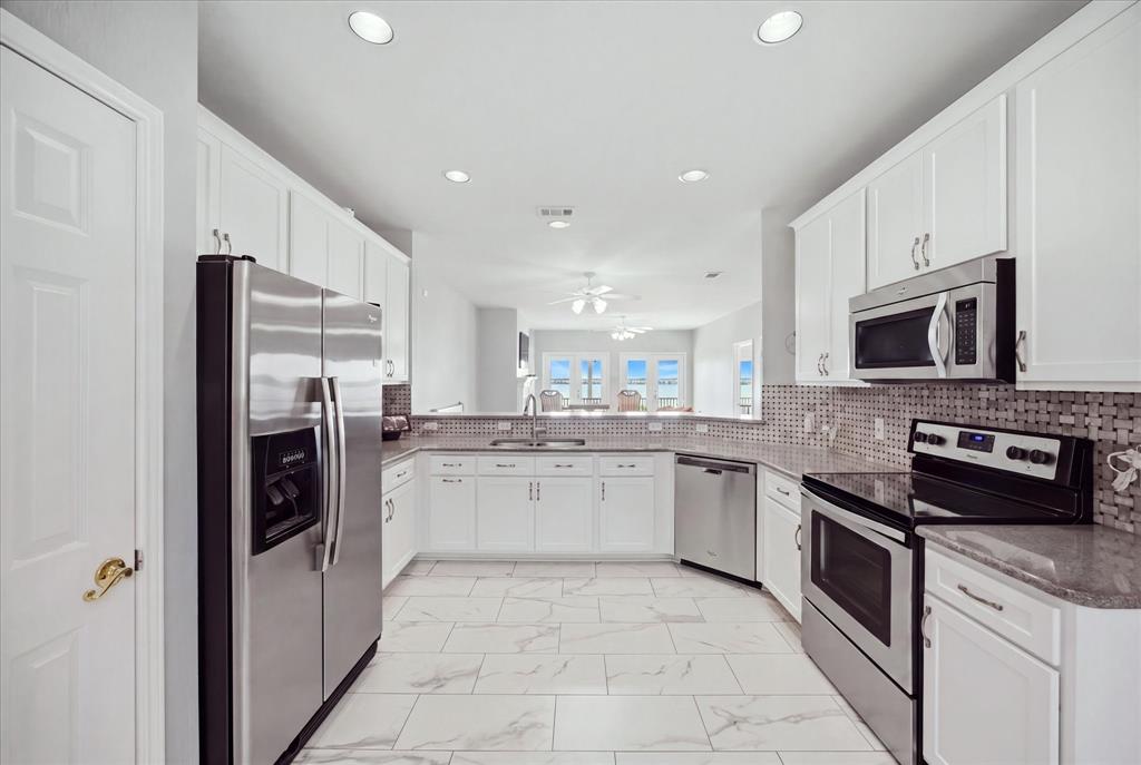 1846 Signal Ridge Place, Unit B4 Rockwall, TX 75032 - Photo 16 of 27 Updated kitchen includes an abundance of cabinetry and counter top space