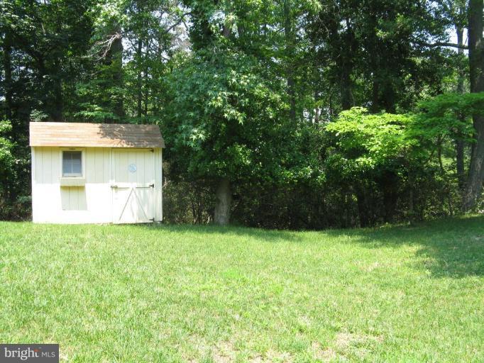 11120 Cove Lake Road Lusby, MD 20657 - Photo 15 of 28 Backyard- shed