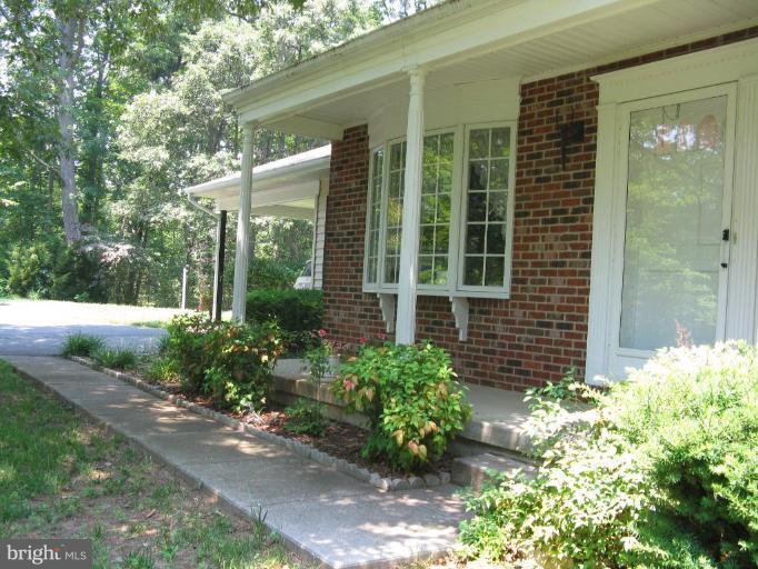 11120 Cove Lake Road Lusby, MD 20657 - Photo 16 of 28 Sidewalk to front door