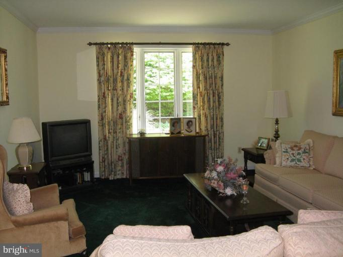 11120 Cove Lake Road Lusby, MD 20657 - Photo 18 of 28 Living Room with window to backyard