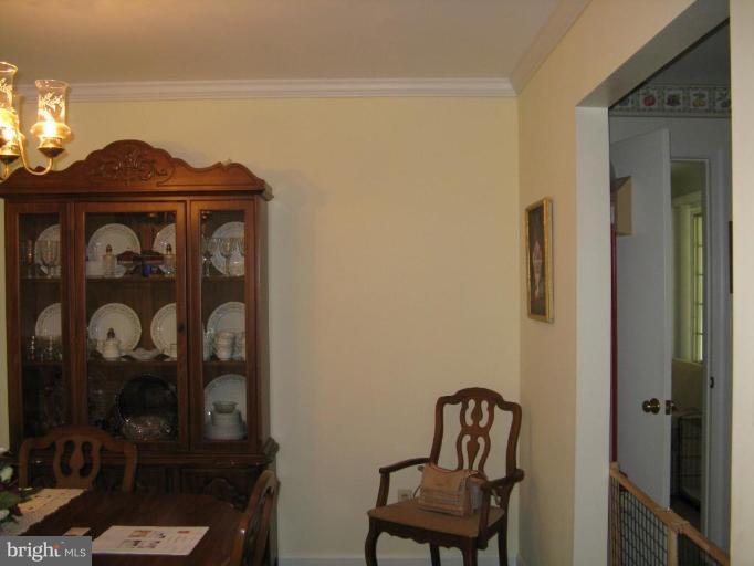 11120 Cove Lake Road Lusby, MD 20657 - Photo 24 of 28 Dining room off of kitchen and sunroom/family room