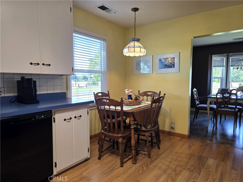 23773 River Road Corning, CA 96021 - Photo 8 of 64 a view of a dining room with furniture window and wooden floor