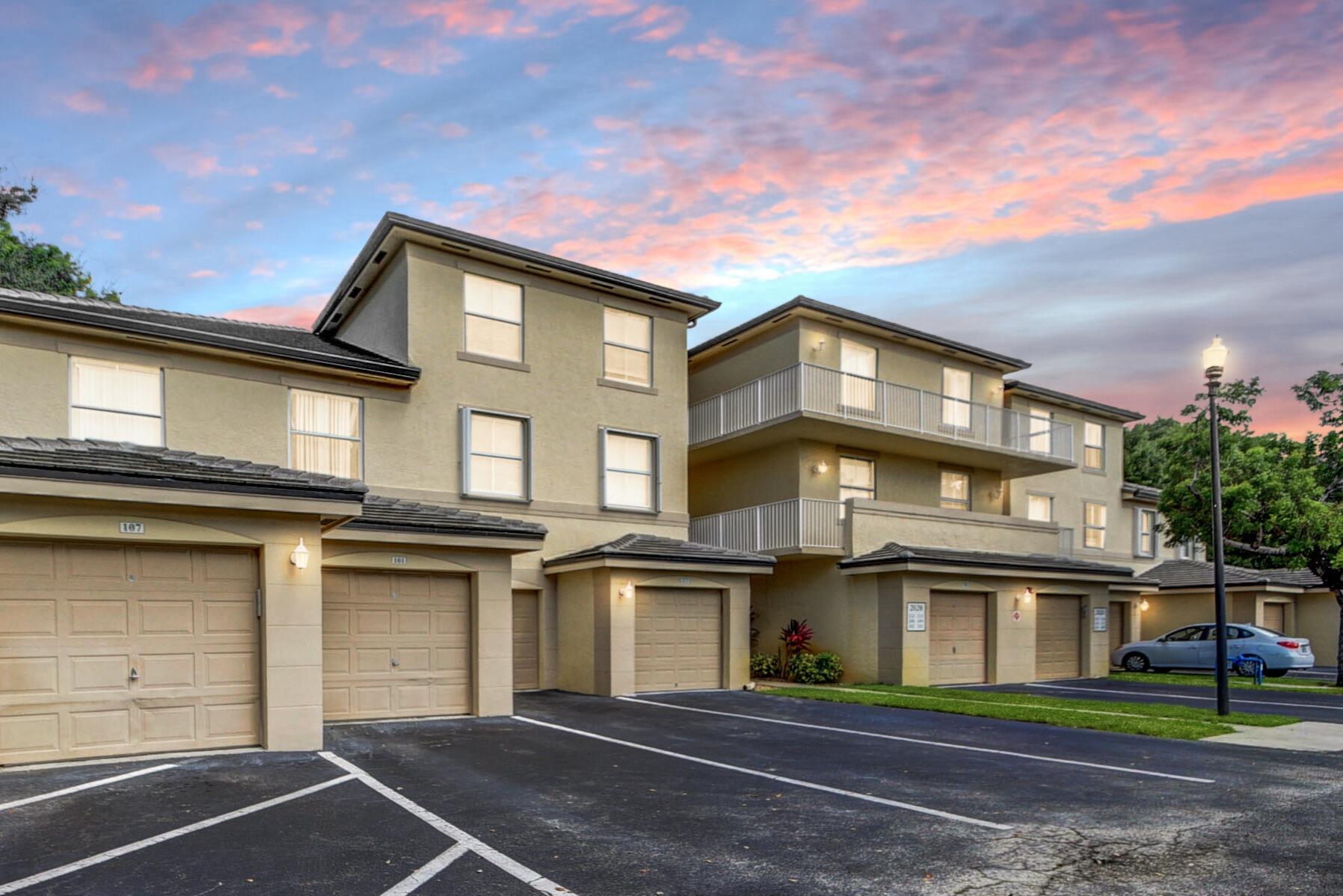 2020 Greenview Shores Boulevard, Unit 108 Wellington, FL 33414 - Photo 1 of 25 a front view of a house