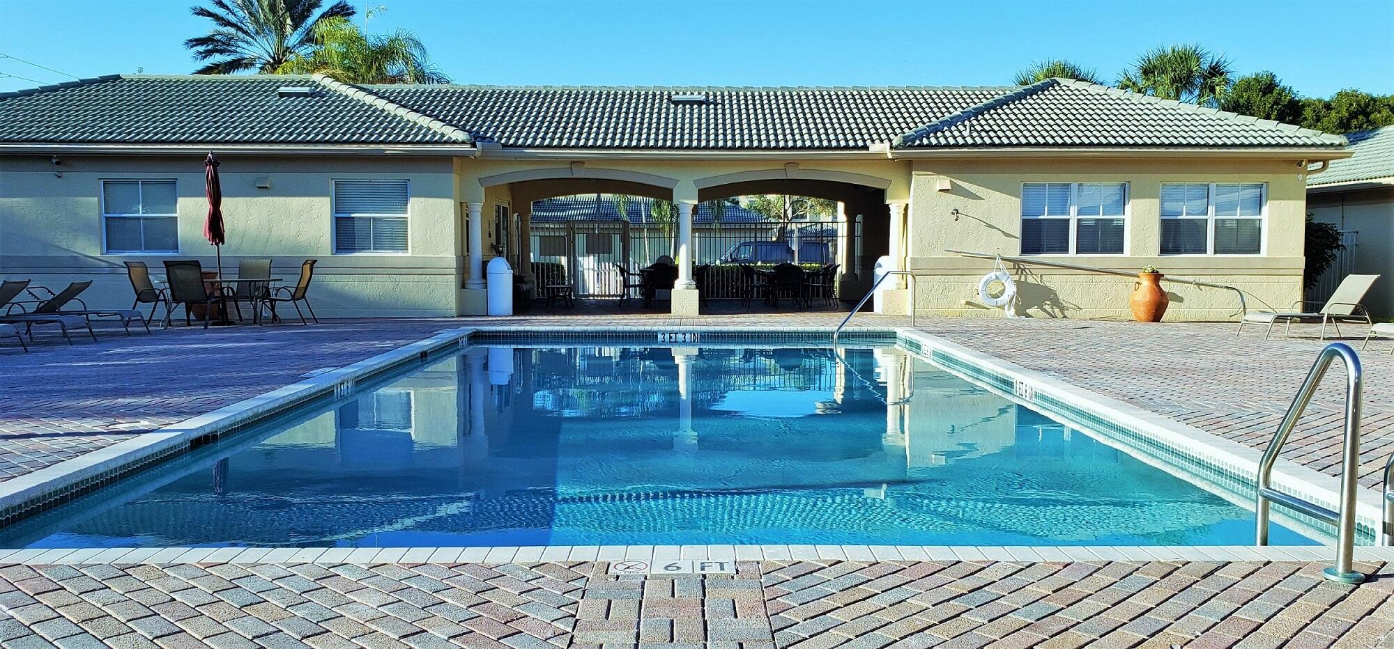 2020 Greenview Shores Boulevard, Unit 108 Wellington, FL 33414 - Photo 20 of 25 a view of a house with backyard