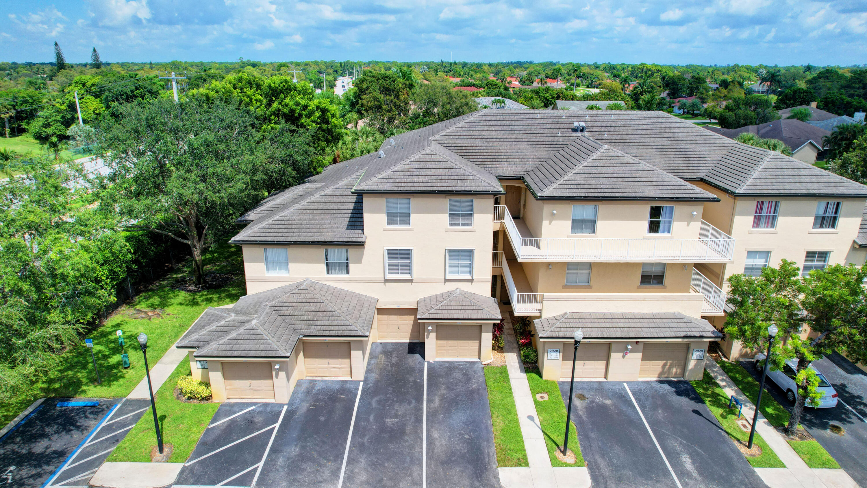 2020 Greenview Shores Boulevard, Unit 108 Wellington, FL 33414 - Photo 24 of 25 a aerial view of a house with swimming pool garden and patio