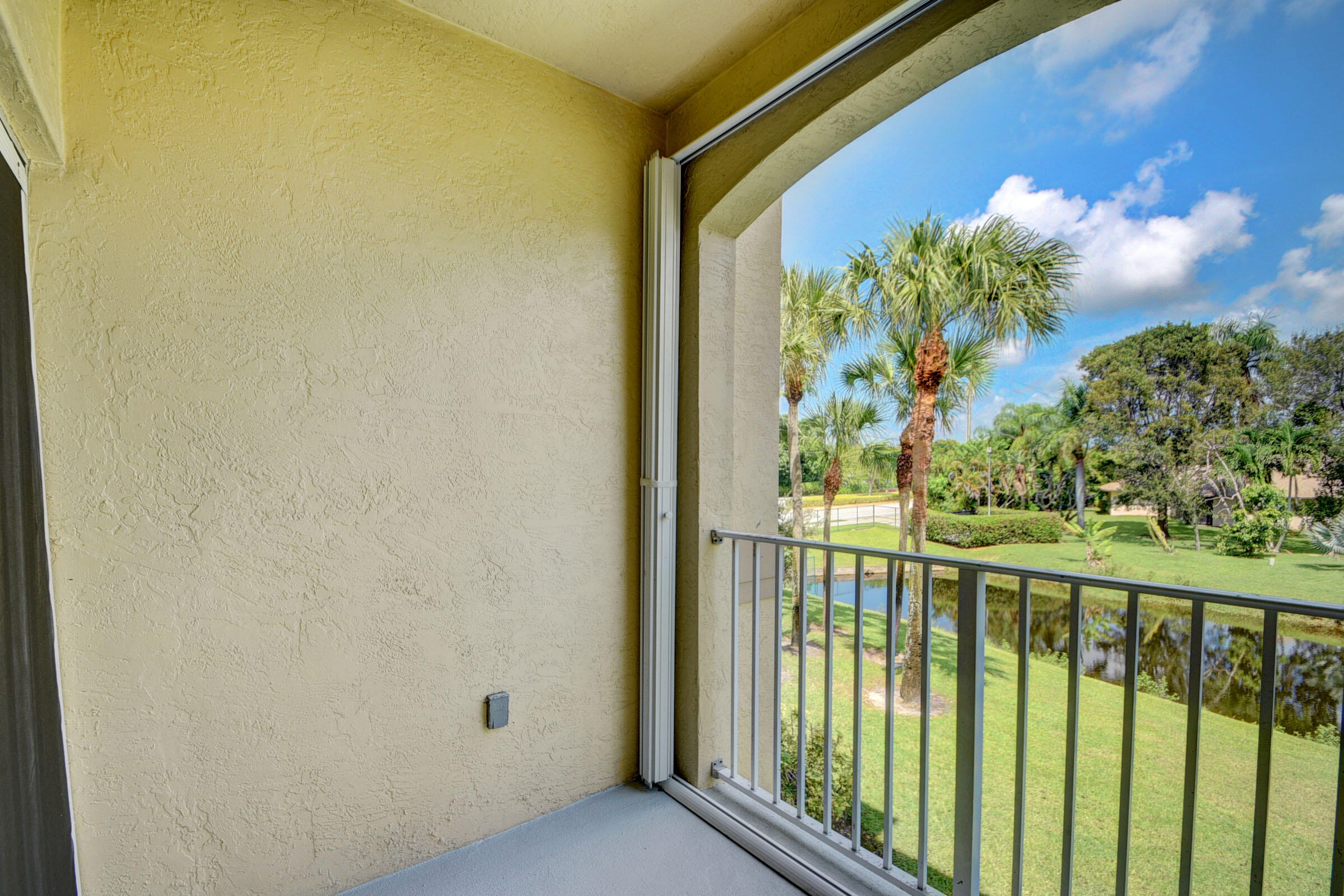 2020 Greenview Shores Boulevard, Unit 108 Wellington, FL 33414 - Photo 3 of 25 a view of a porch