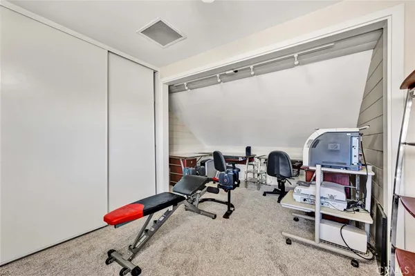 a view of living room with furniture and flat screen tv