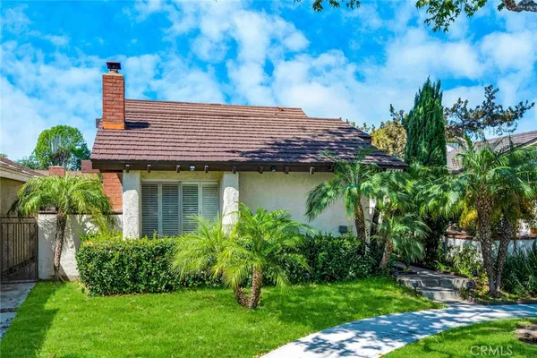 a view of a house with a garden