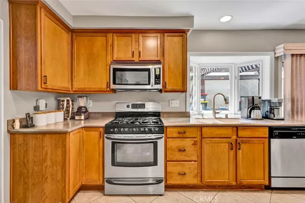 a view of a kitchen with a dining table and chairs