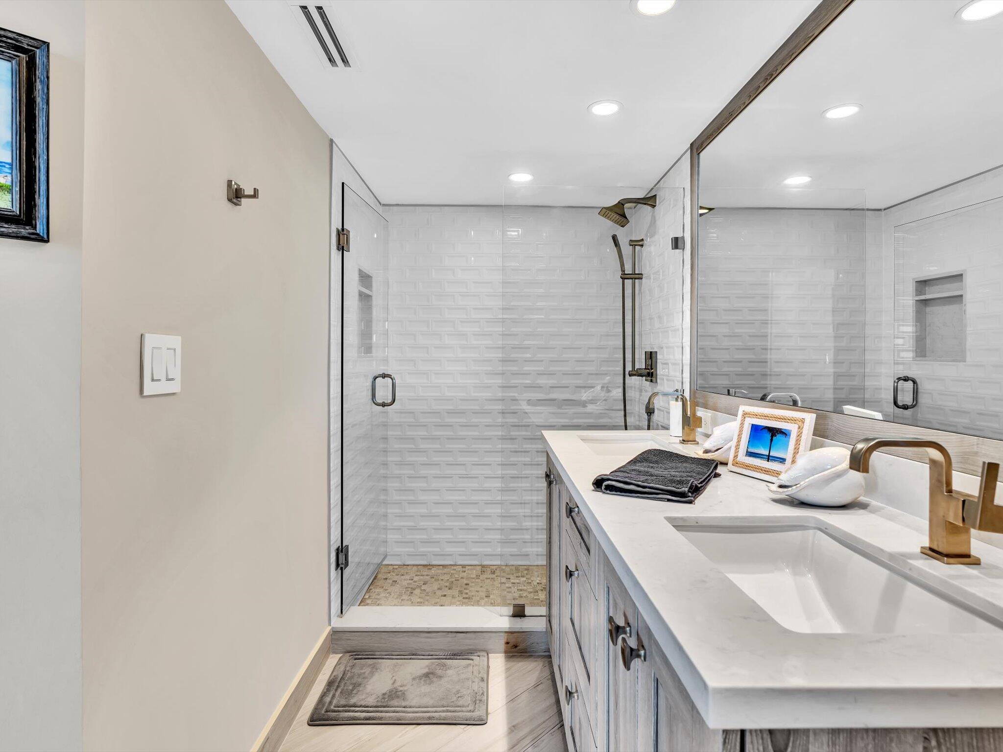 500 South Ocean Boulevard, Unit 909 Boca Raton, FL 33432 - Photo 42 of 101 a bathroom with a sink a toilet and shower