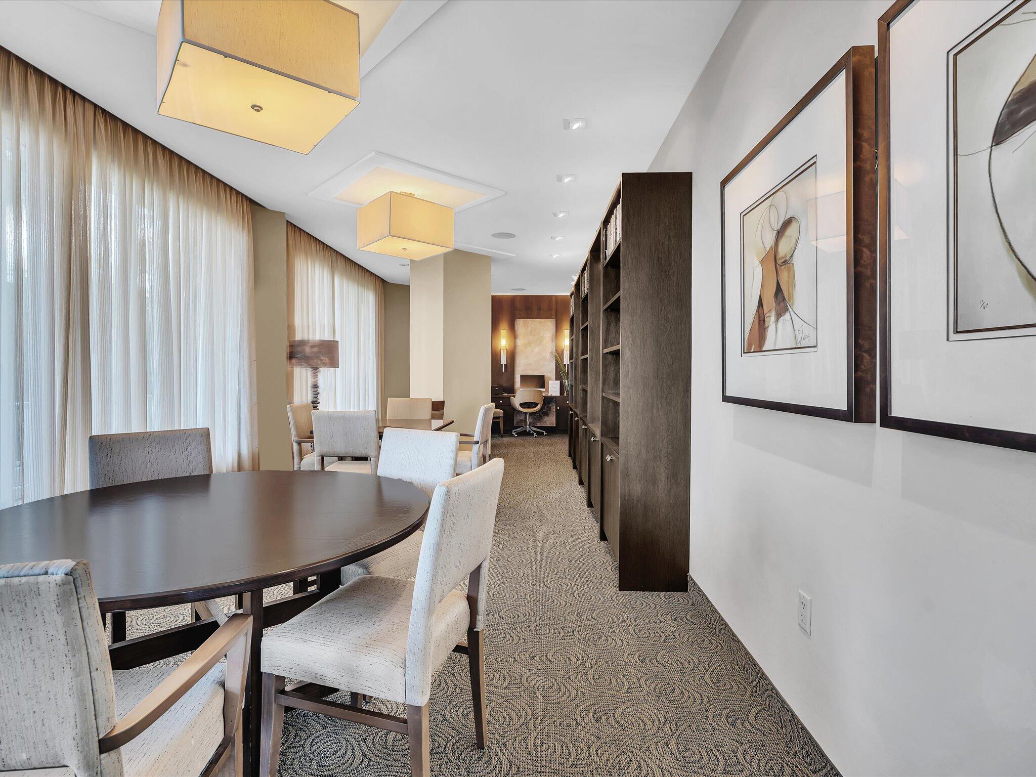 500 South Ocean Boulevard, Unit 909 Boca Raton, FL 33432 - Photo 53 of 101 a view of a dining room with furniture window and wooden floor