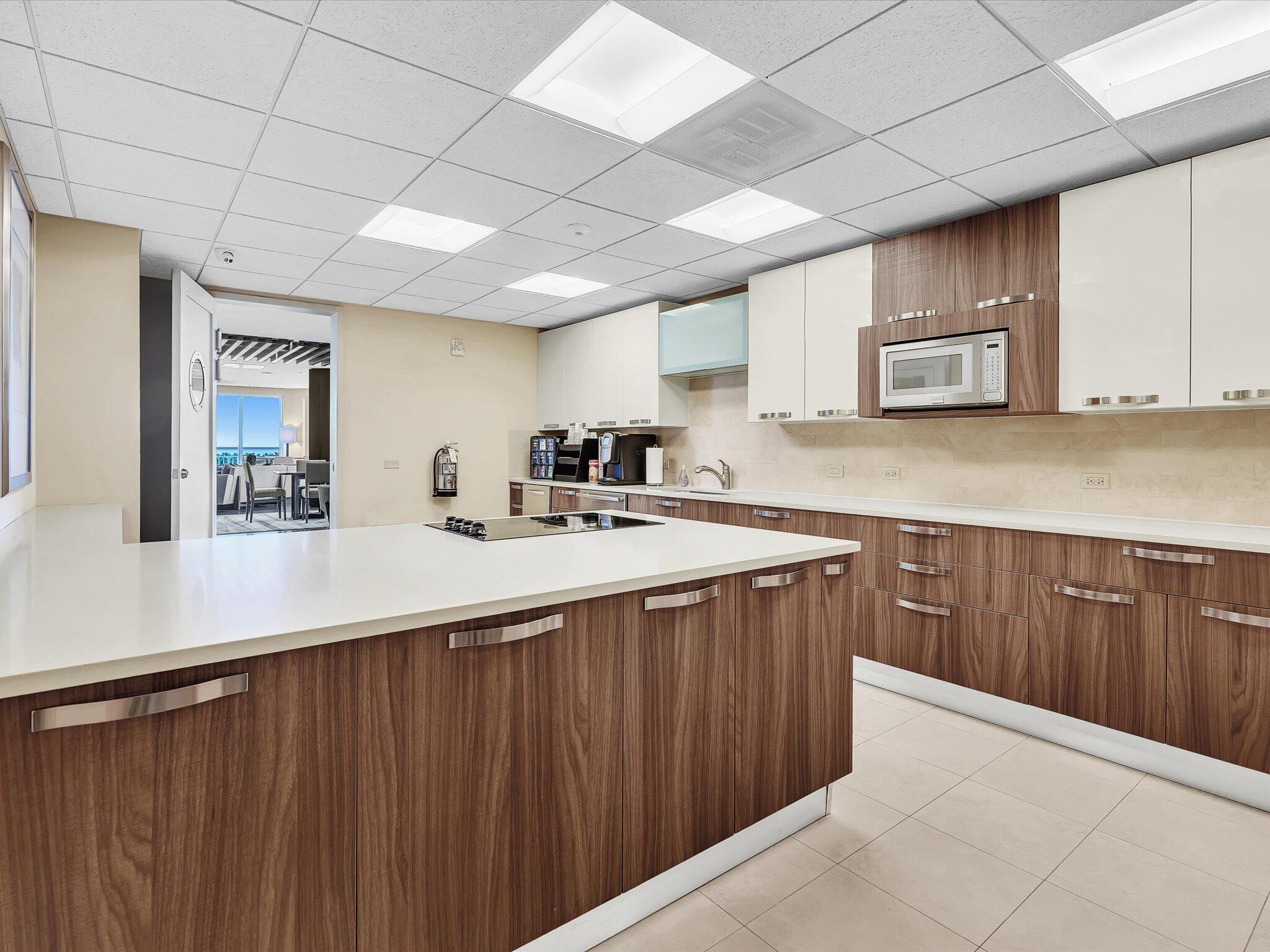 500 South Ocean Boulevard, Unit 909 Boca Raton, FL 33432 - Photo 56 of 101 a kitchen with stainless steel appliances granite countertop a sink stove and cabinets