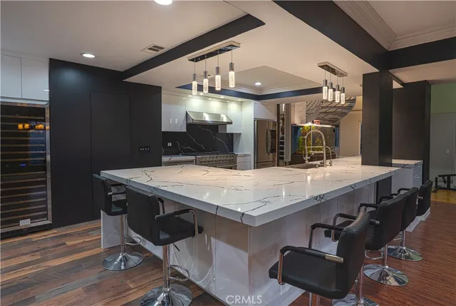 a kitchen with a stove top oven sink and cabinets